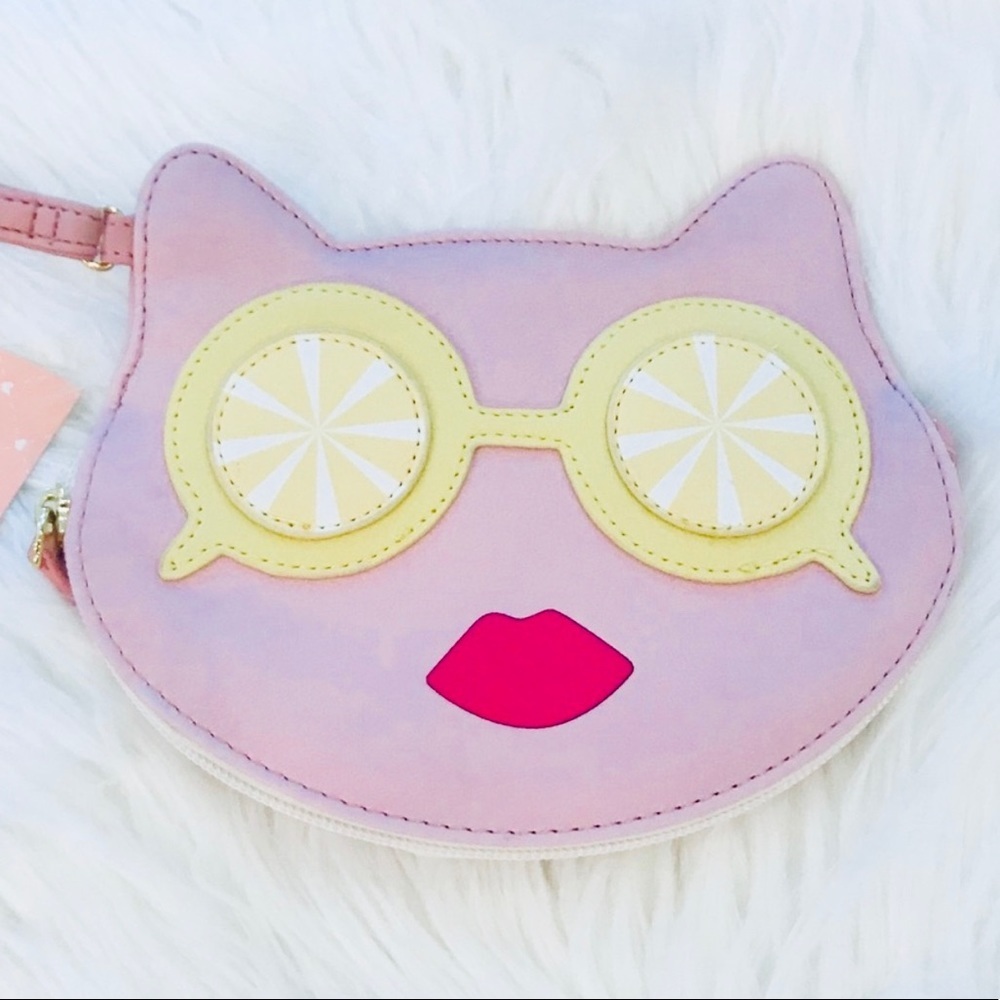 Betsey Johnson lemon eyes cat wristlet. 😍